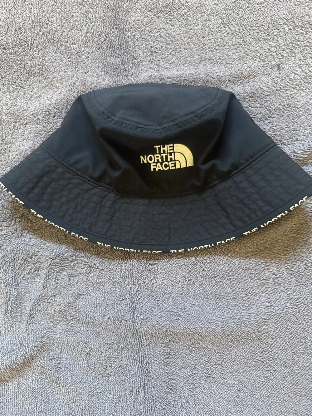 The North Face Black Bucket Hat with White Logo Trim